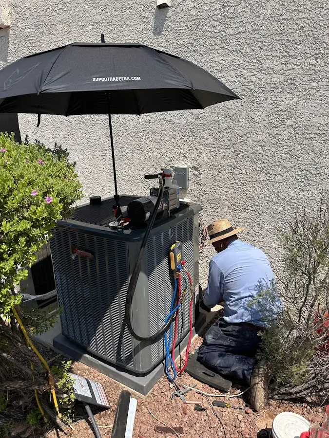 HVAC technician performing outdoor AC maintenance in Newington Forest